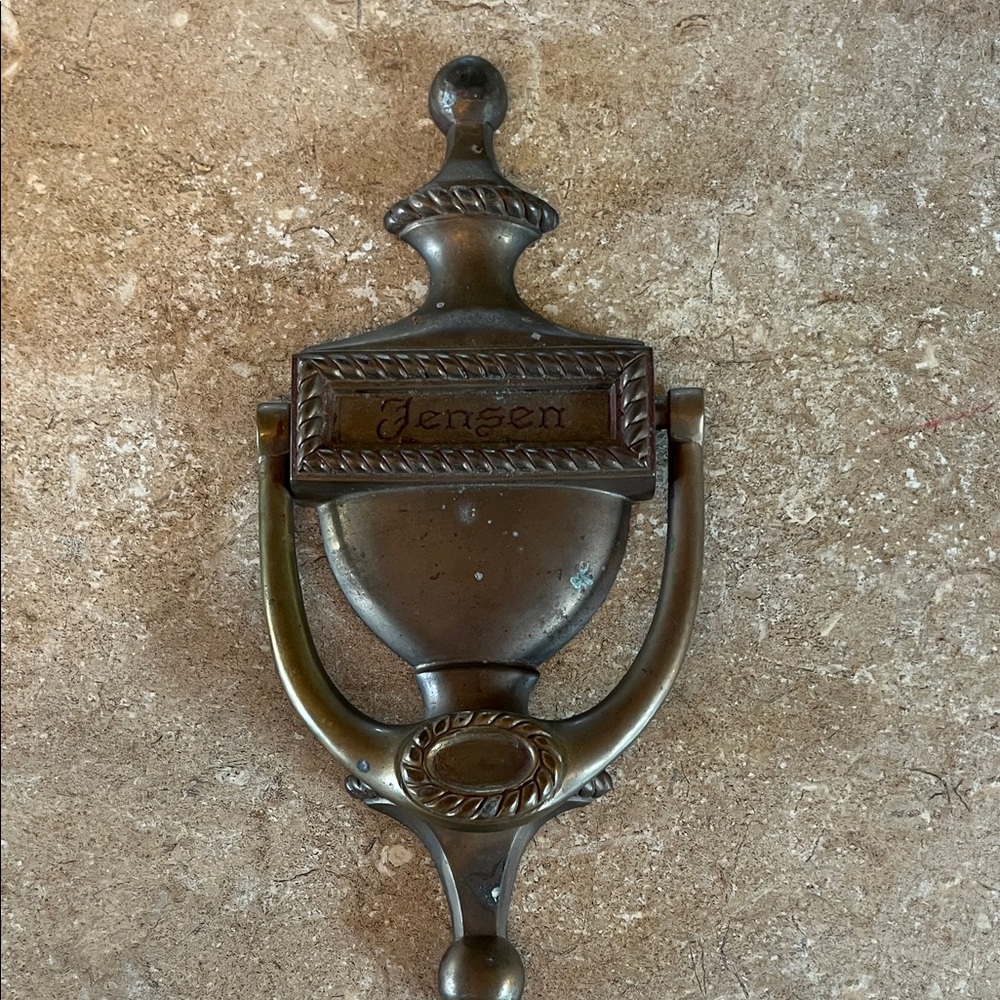 Brass door knocker 8” long
Personalized with Jensen.. needs to be polished